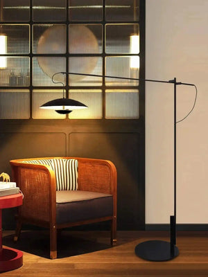 Sleek black floor lamp with a wide, flat circular shade.