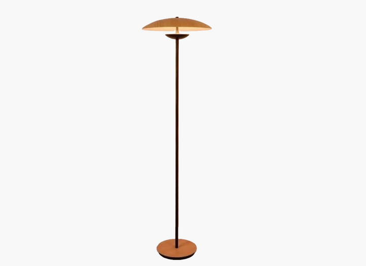 Modern floor lamp with a circular copper-colored shade and slender stem.