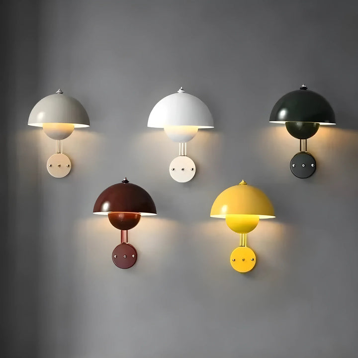 Collection of colorful dome-shaped wall sconces with circular bases.