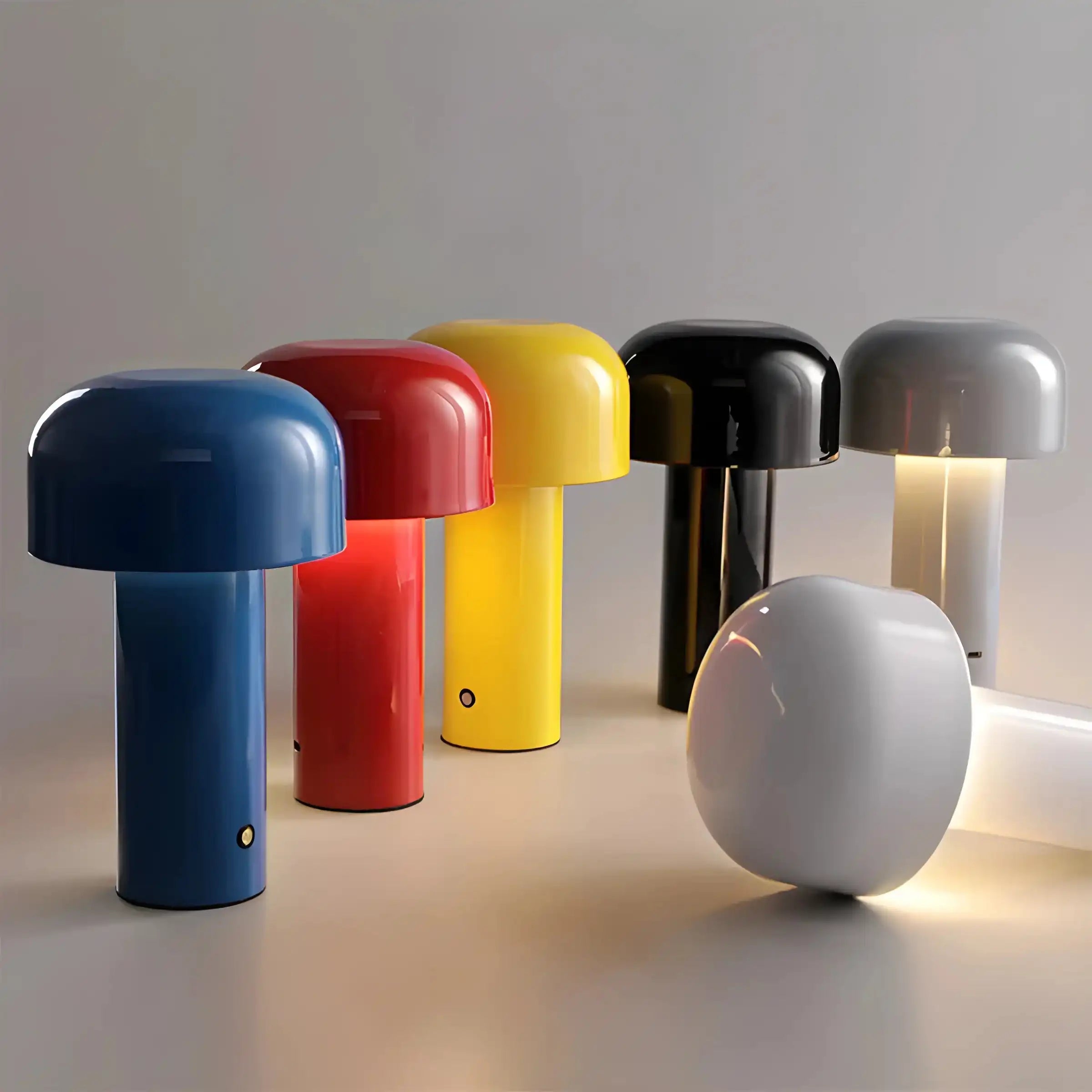 Colorful mushroom-shaped table lamps in various hues.