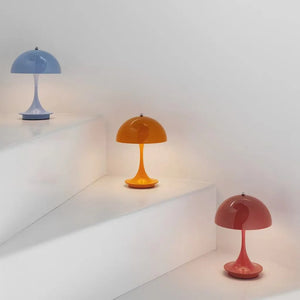 Colorful retro-style mushroom lamps on stepped surfaces.