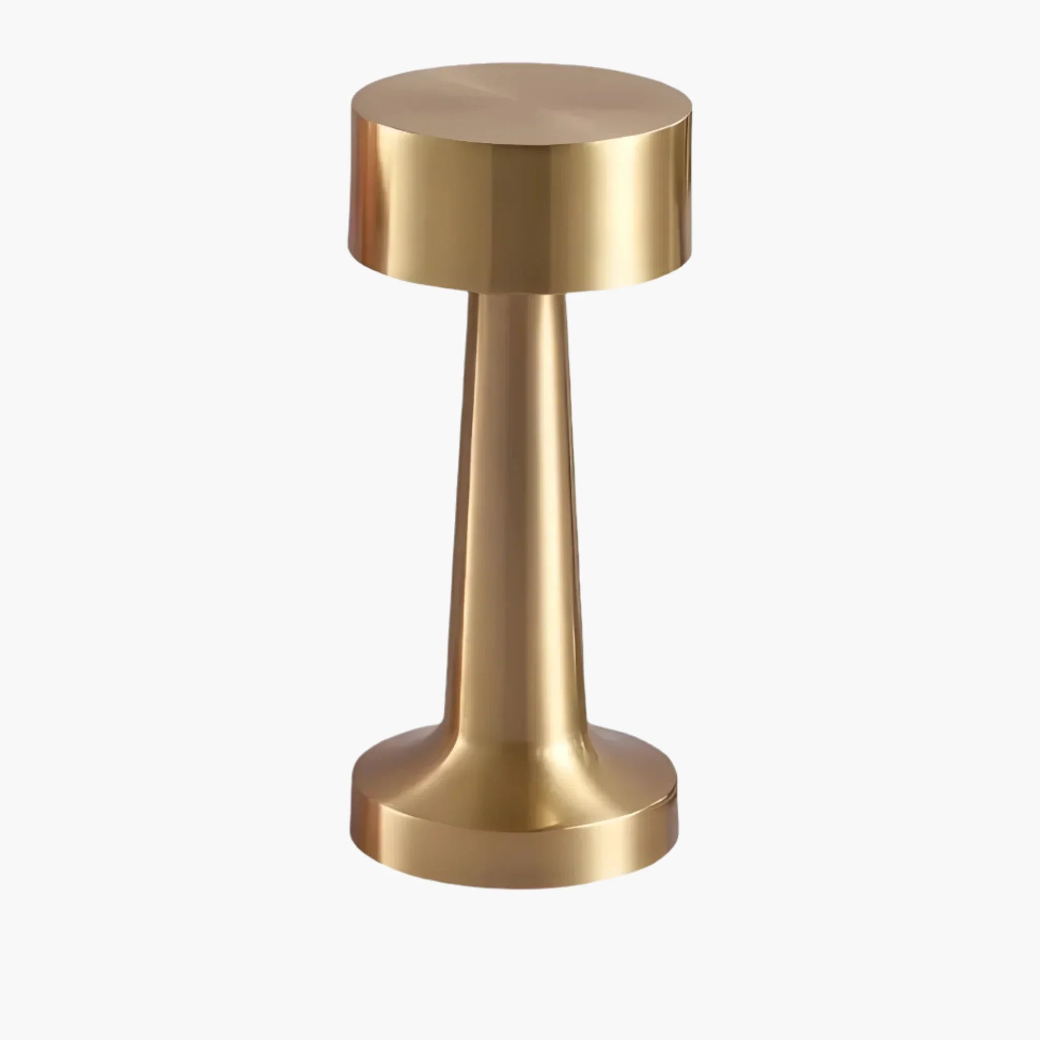 Gold-colored metal door stopper or handle with a cylindrical base and wider circular top.