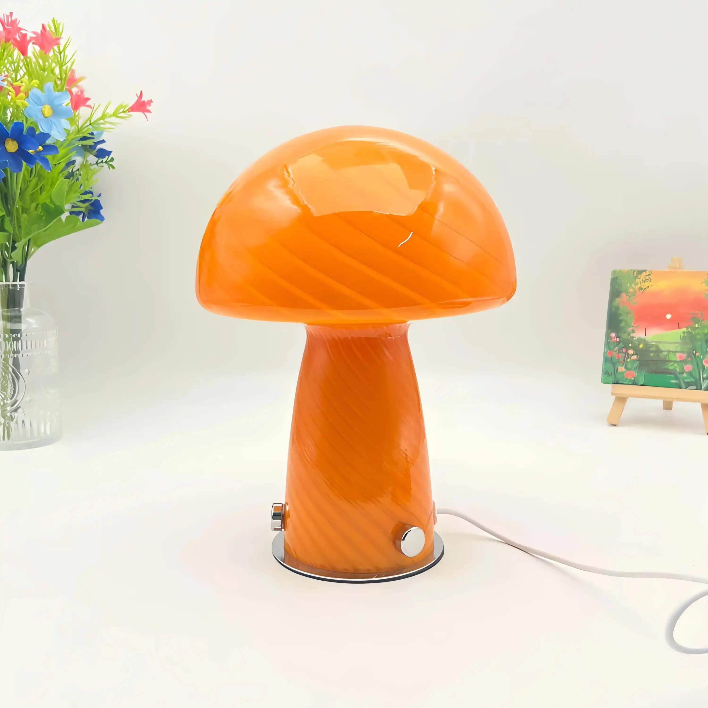 Orange mushroom-shaped table lamp with a glossy finish.