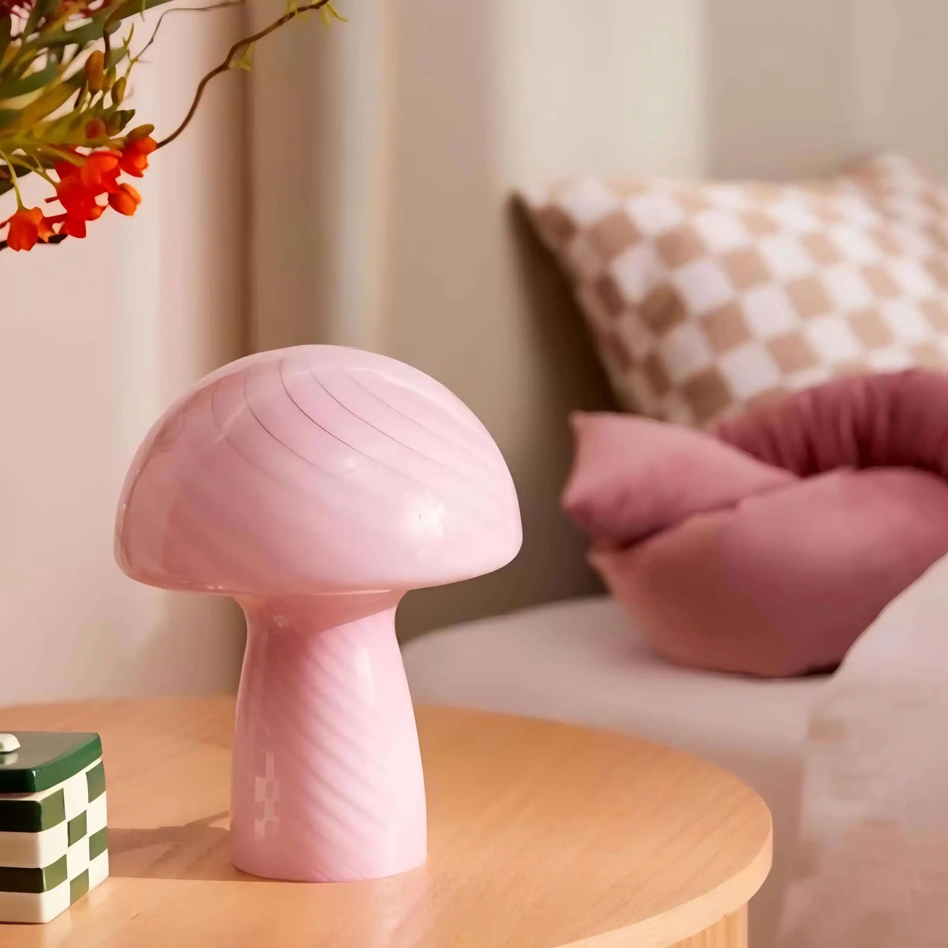 Pink mushroom-shaped lamp or decorative object.