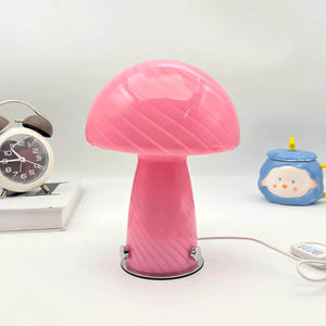 Pink mushroom-shaped table lamp with a glowing dome top.