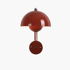 Red dome-shaped wall sconce lamp with a circular base.