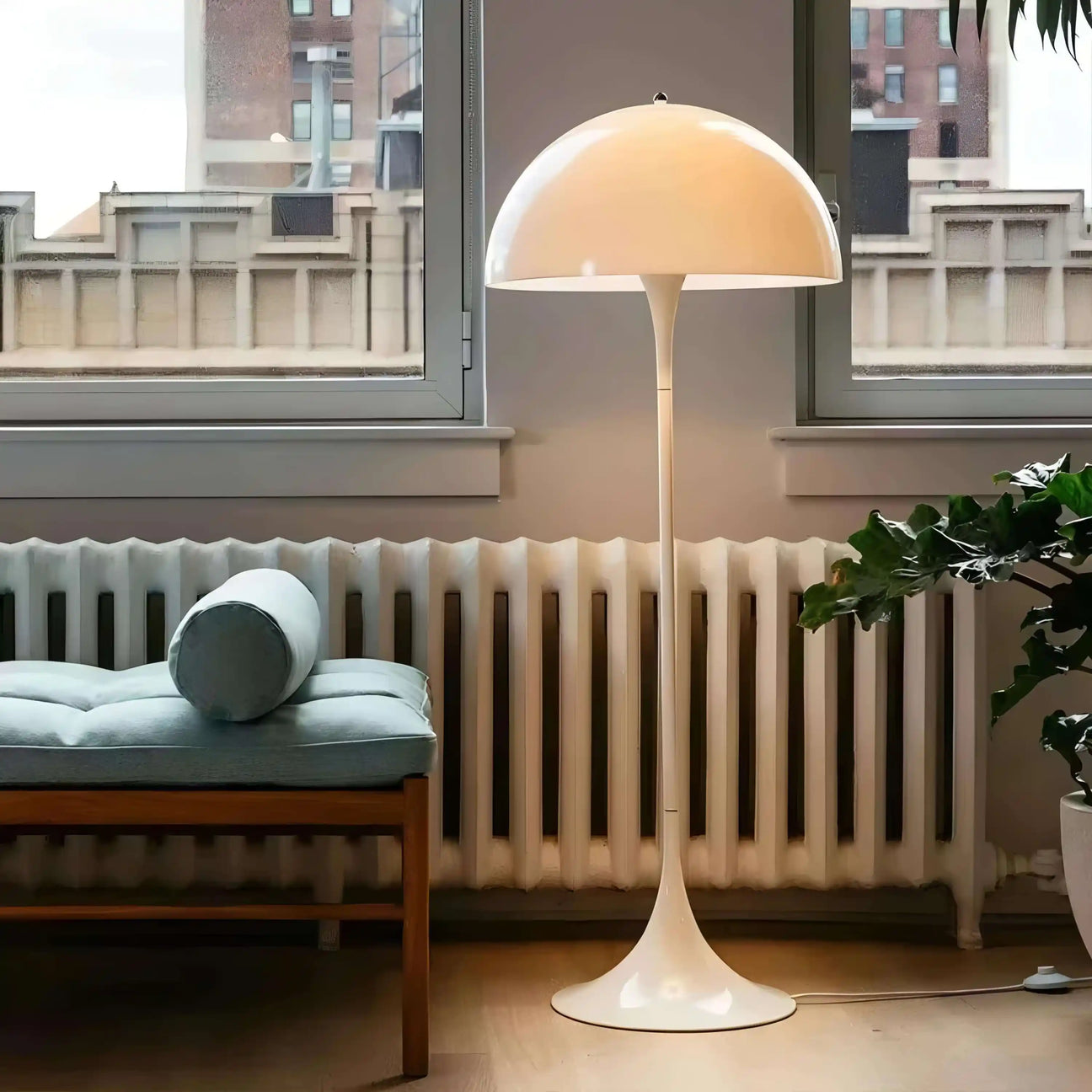 Mushroom-shaped white floor lamp with a domed shade.