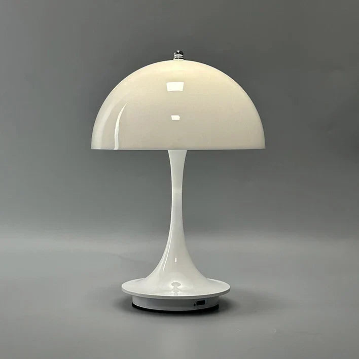 Sleek white mushroom-shaped table lamp with a domed shade and slender stem.