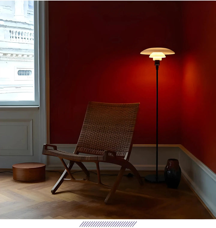 Woven wooden lounge chair with angled legs and backrest.